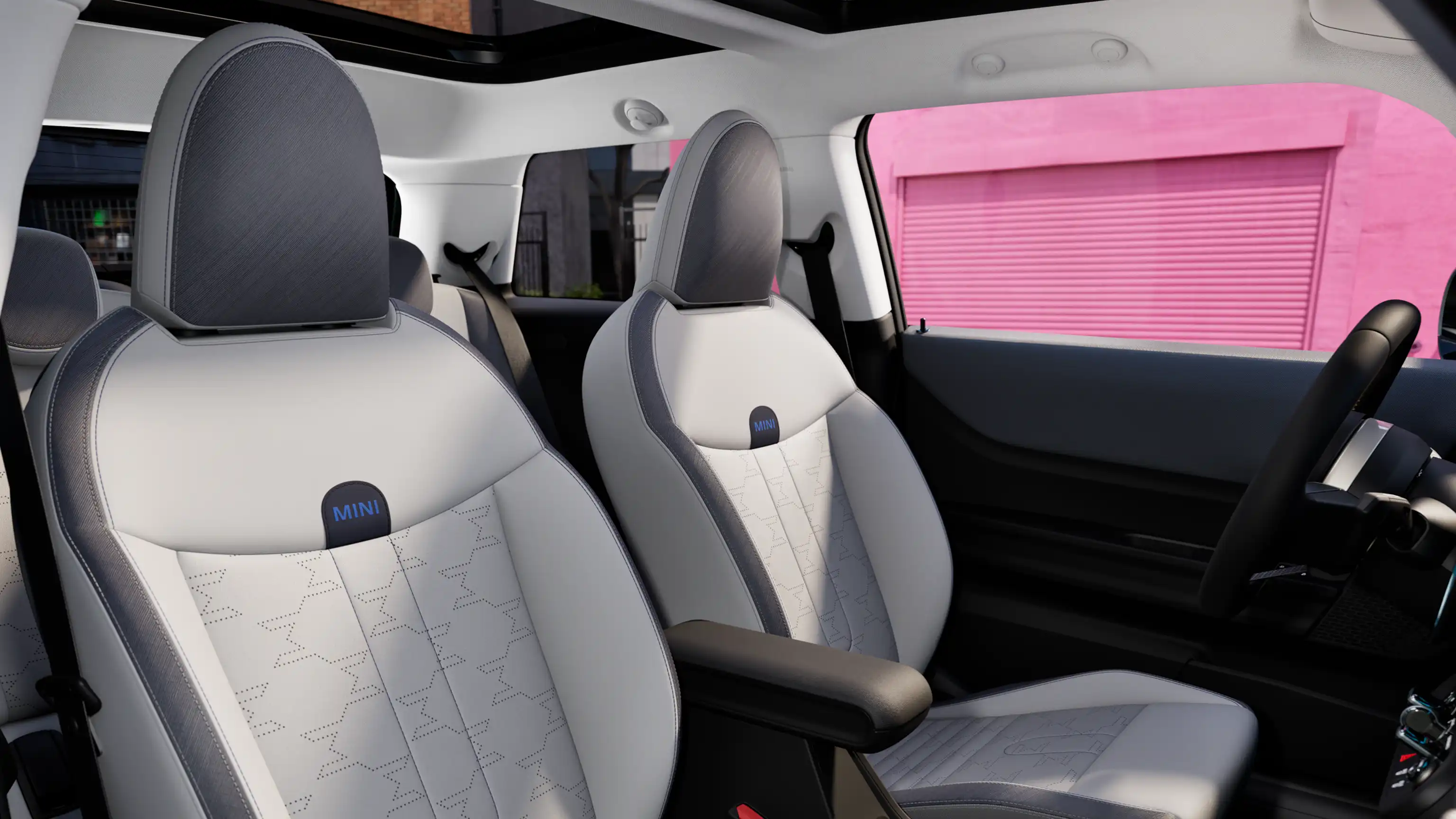 Interior perspective of the MINI Cooper is showing the dashboard, steering wheel, round display, panorama glassroof  and back of the frontseats.