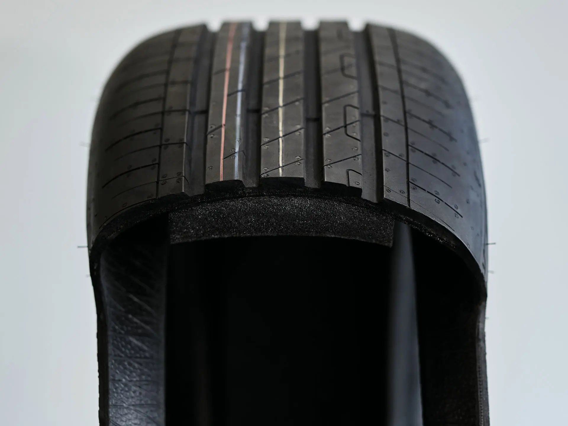 MINI-approved tyre with a layer of foam on the inner surface that absorbs the noise produced by vibrations within the cavity.