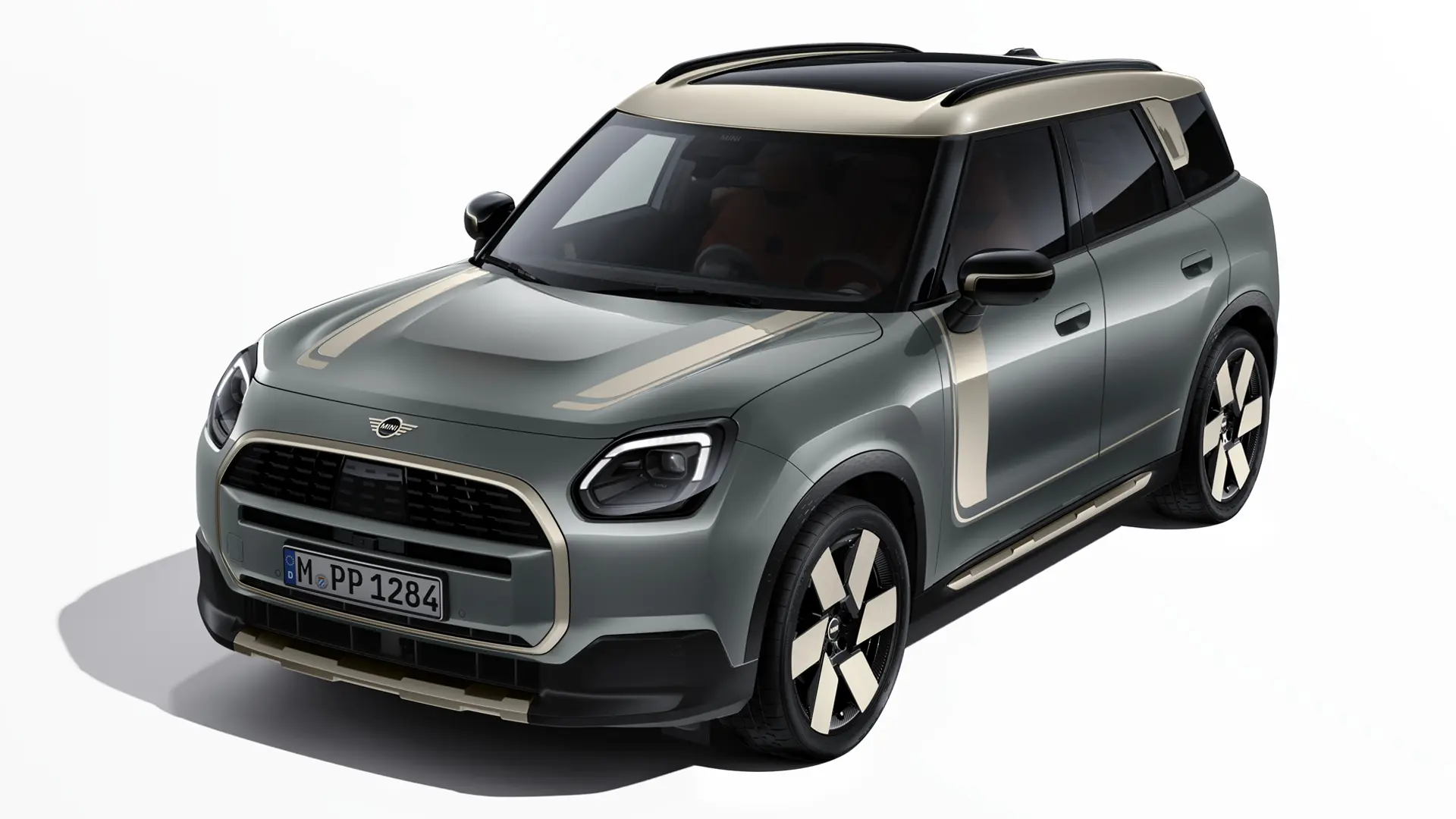 MINI Countryman Electric in Smokey Green with MINI Favoured decals in Vibrant Silver, three quarter view.