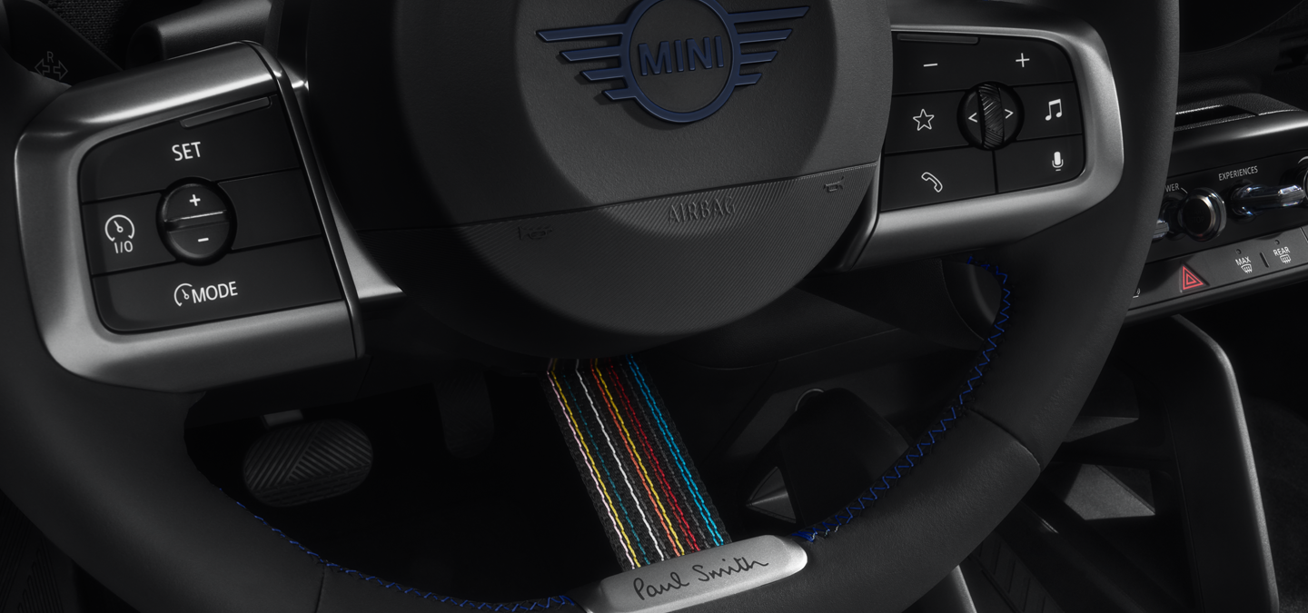 Close shot of the MINI Paul Smith Edition Steering Wheel, showcasing its unique features.